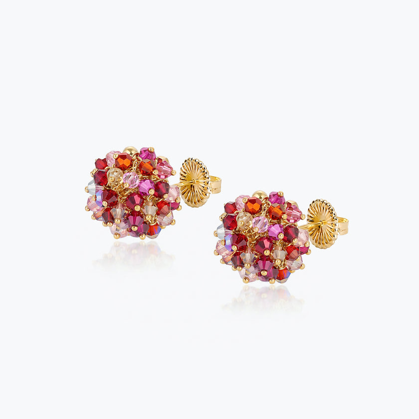 Gold cluster stud earrings with individually hanging crystals in shades of red and pink.
