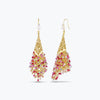 Gold drop earrings showcasing a handknitted wire cone structure filled with individually hanging pink and red crystals.