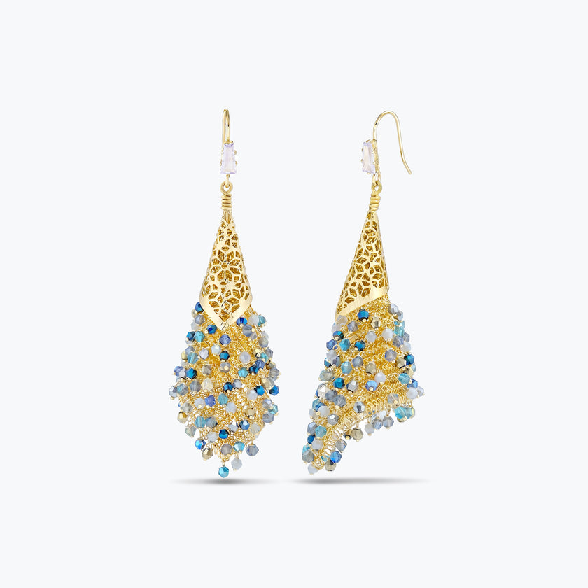 Gold drop earrings with a handknitted wire cone and a cascade of individually hanging blue reflective crystals.