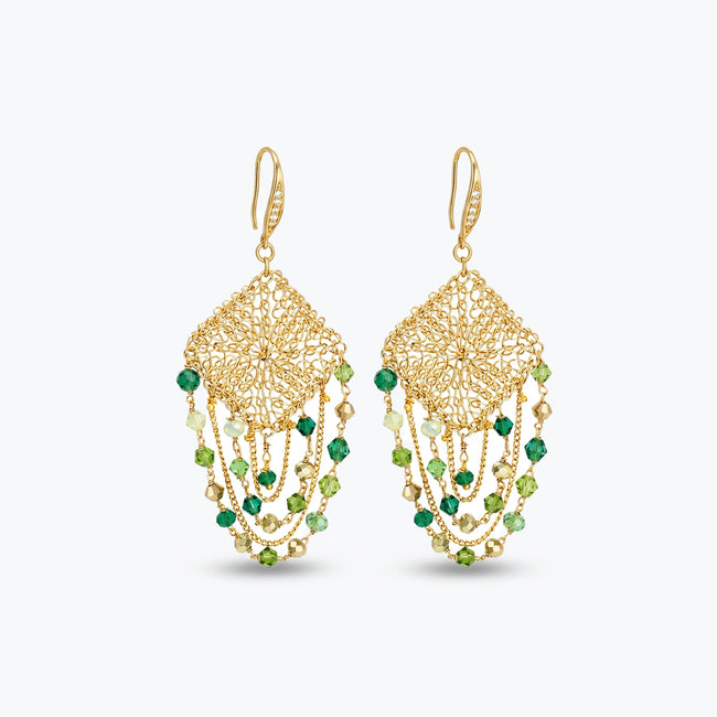 Gold drop earrings showcasing a diamond-shaped handknitted wire square panel with suspended rows of green premium crystals.

