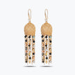 Gold drop earrings featuring a sphere-shaped handknitted wire shape and tassel strands of black and bronze crystals.