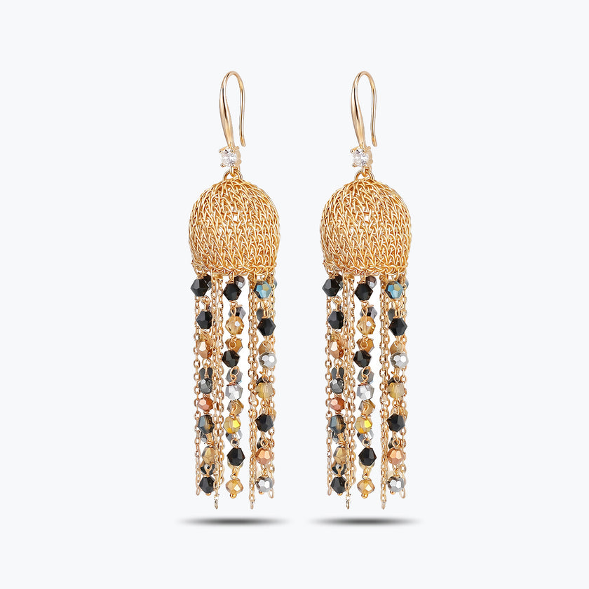 Gold drop earrings featuring a sphere-shaped handknitted wire shape and tassel strands of black and bronze crystals.