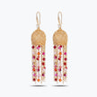Gold drop earrings with a handknitted wire sphere and elegant linear tassel strands of vibrant red crystals.