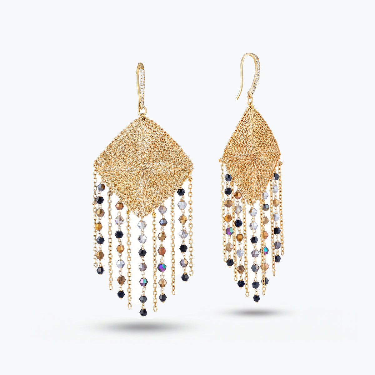 Gold drop earrings featuring a  handknitted wire mesh rhombus panel and tassel strands of metallic gray premium crystals.