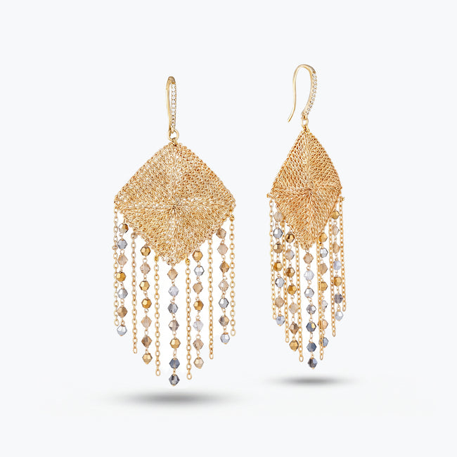 Gold drop earrings displaying a teardrop handknitted wire mesh rhombus panel and hanging clear and champagne premium crystals.