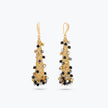 Handknitted wire mesh coned earrings studded with individually hanging crystals in black, bronze, and silver.