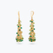Conical earrings made of handknitted wire mesh featuring reflective crystals in shades of green and gold.