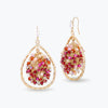 Gold drop earrings with handknitted wire mesh teardrop shape holding individually hanging pink and red crystals.