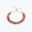 Gold handknitted wire slider bracelet adorned with premium crystals in ruby red and fuchsia pink.
