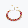 Gold handknitted wire slider bracelet adorned with premium crystals in ruby red and fuchsia pink.