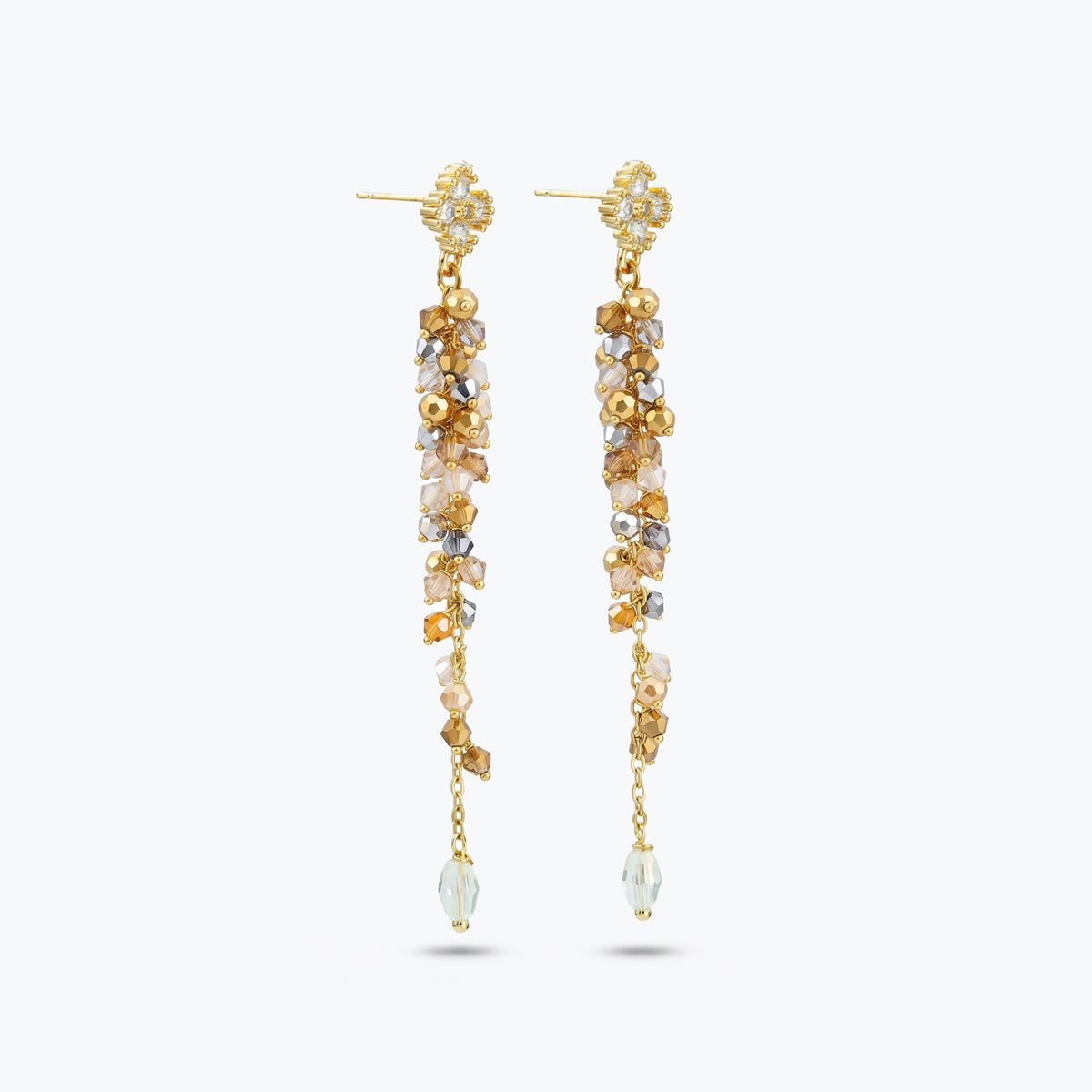 Gold drop earrings featuring a long linear handknitted wire design with hanging champagne and clear premium crystals.
