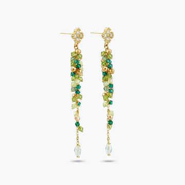 Gold drop earrings with a vertical handknitted wire mesh strip trailing down into green individually hanging crystals.
