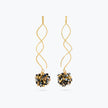 Gold twisted wire drop earrings with a sphere of reflective crystals in black, silver, and gold colors.