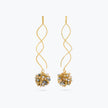 Gold wavy drop earrings with a cluster of premium crystals in metallic gold and champagne tones.