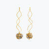 Gold wavy drop earrings with a cluster of premium crystals in metallic gold and champagne tones.