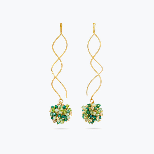 Gold spiral long earrings featuring a cluster of premium crystals in vibrant emerald and lime green hues.