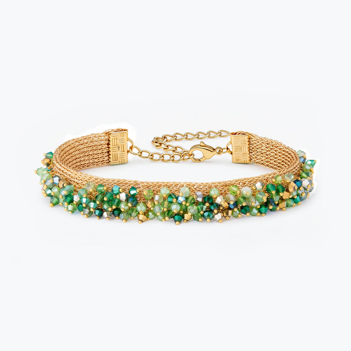 Gold handknitted wire mesh bracelet showcasing emerald, olive, and mint green premium crystals.