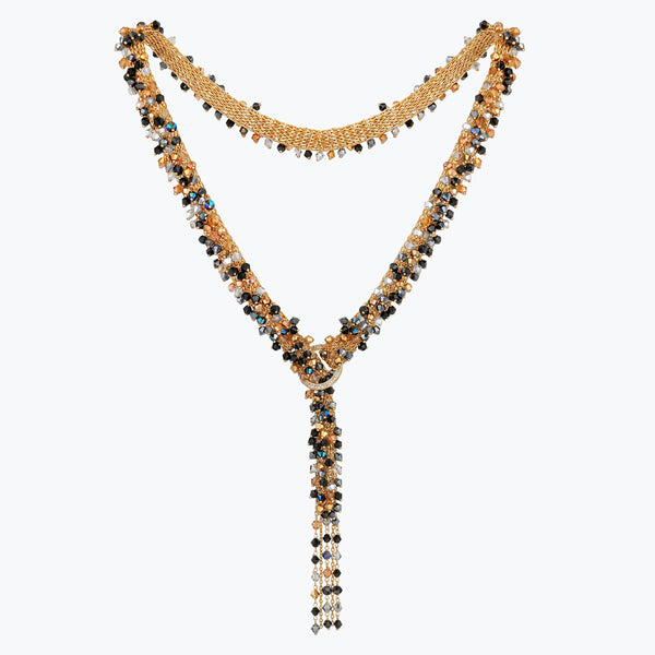 Gold bolo-tie necklace featuring a handknitted wire mesh band clustered with black and bronze reflective crystals.
