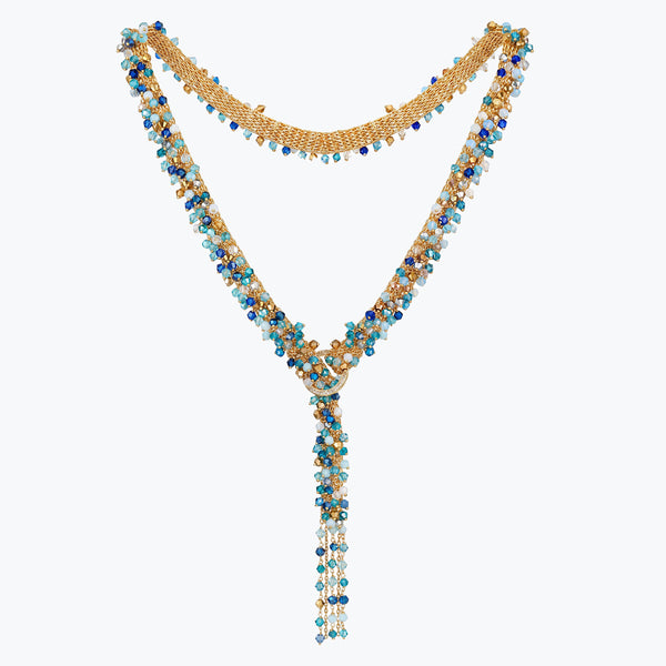 Gold bolo-tie necklace woven in wire mesh with a cluster of cobalt blue, teal, and aqua premium crystals.