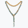Gold bolo-tie necklace woven in wire mesh with a cluster of cobalt blue, teal, and aqua premium crystals.
