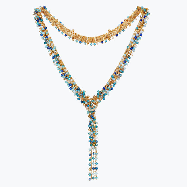 Gold bolo-tie necklace woven in wire mesh with a cluster of cobalt blue, teal, and aqua premium crystals.