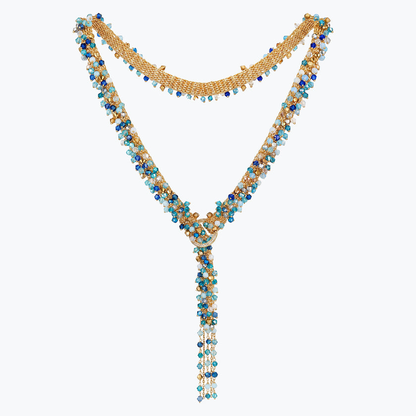 Gold bolo-tie necklace woven in wire mesh with a cluster of cobalt blue, teal, and aqua premium crystals.
