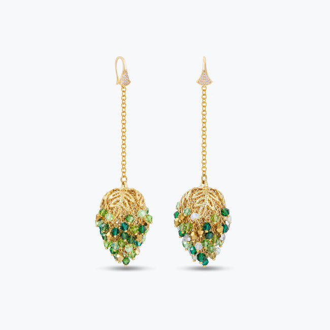 Dangle drop earrings in gold with handknitted wire accents and reflective crystals in vibrant shades of green.