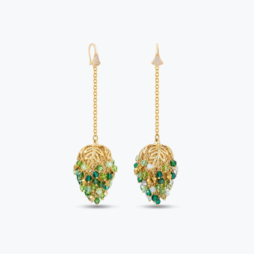 Dangle drop earrings in gold with handknitted wire accents and reflective crystals in vibrant shades of green.