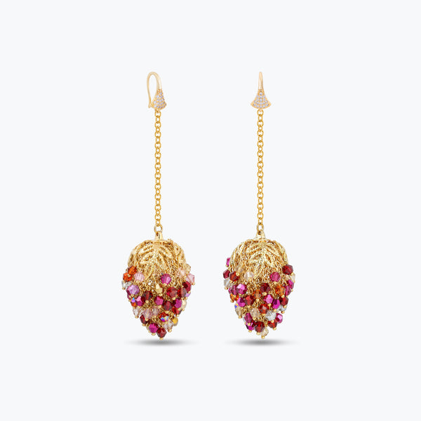 Long gold drop earrings featuring a handknitted wire mesh pod tightly packed with red and pink premium crystals.