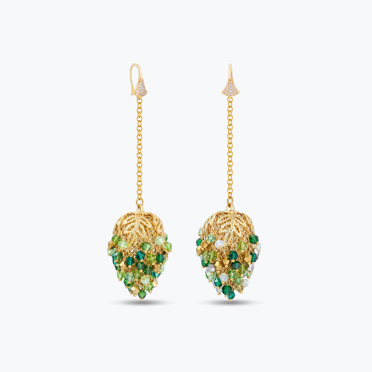 Dangle drop earrings in gold with handknitted wire accents and reflective crystals in vibrant shades of green.