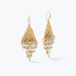 Gold drop earrings showing a vertical handknitted trianglular wire mesh holding individually hanging clear and champagne crystals.