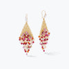 Gold drop earrings showcasing a handknitted wire mesh triangle decorated with hanging pink and red crystals.