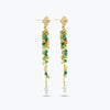Gold drop earrings with a vertical handknitted wire mesh strip trailing down into green individually hanging crystals.
