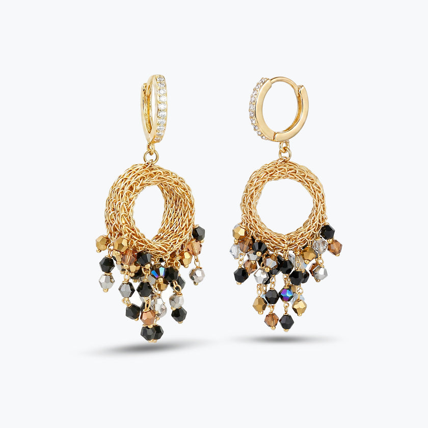 Handknitted wire mesh gold earrings accented with individually hanging crystals in black, silver, and bronze.