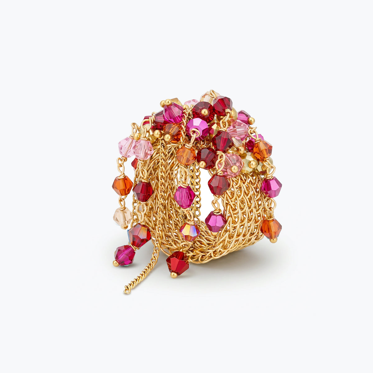 Gold handknitted wire statement ring embedded with premium crystals in ruby red, fuchsia, and pink hues.