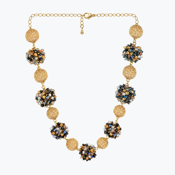 Gold handknitted sphere wire mesh ball necklace featuring individually hanging crystals in black, bronze, and silver.