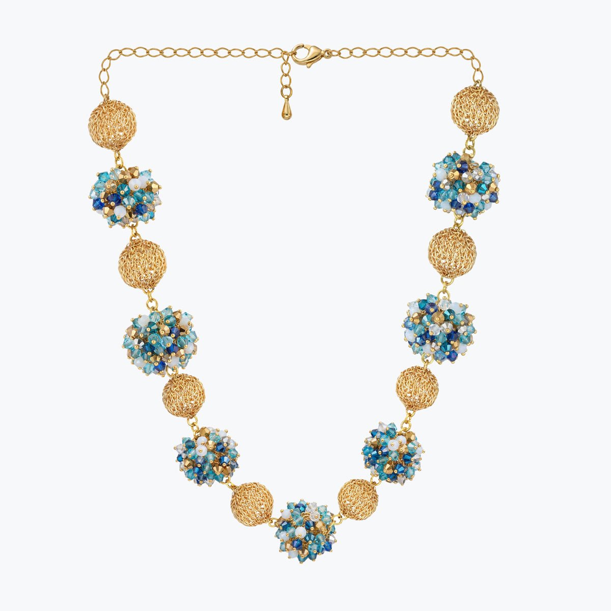 Gold handknitted sphere wire mesh ball necklace featuring individually blue, turquoise, and aqua crystals.