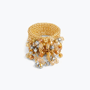 Wide gold mesh ring featuring individually hanging crystals in shades of champagne, amber, and silver.