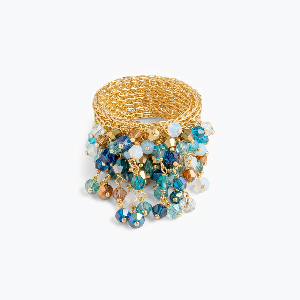 Wide handknitted wire mesh gold ring adorned with blue, aqua, and bronze individually hanging crystals.