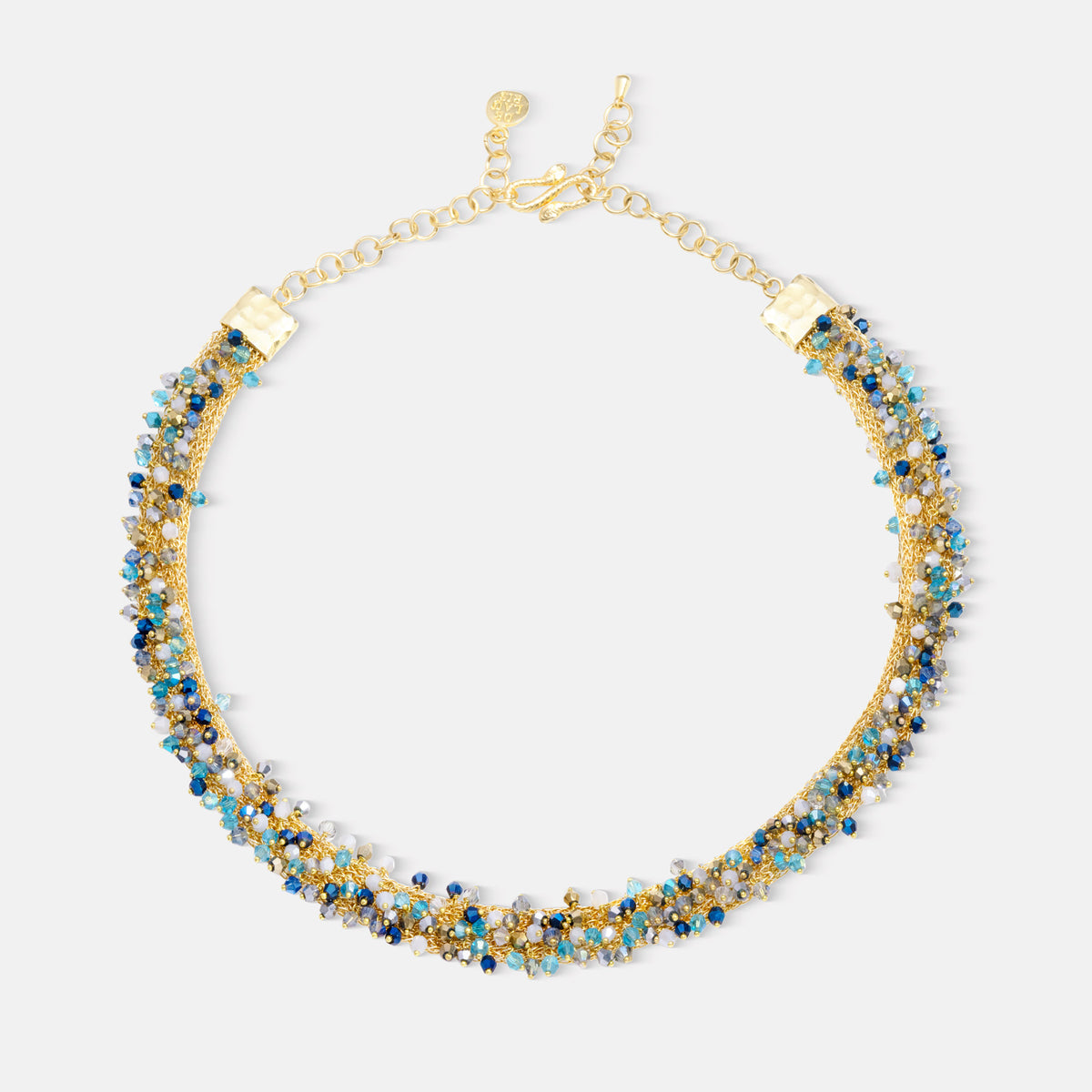Gold and blue beaded necklace on a white background