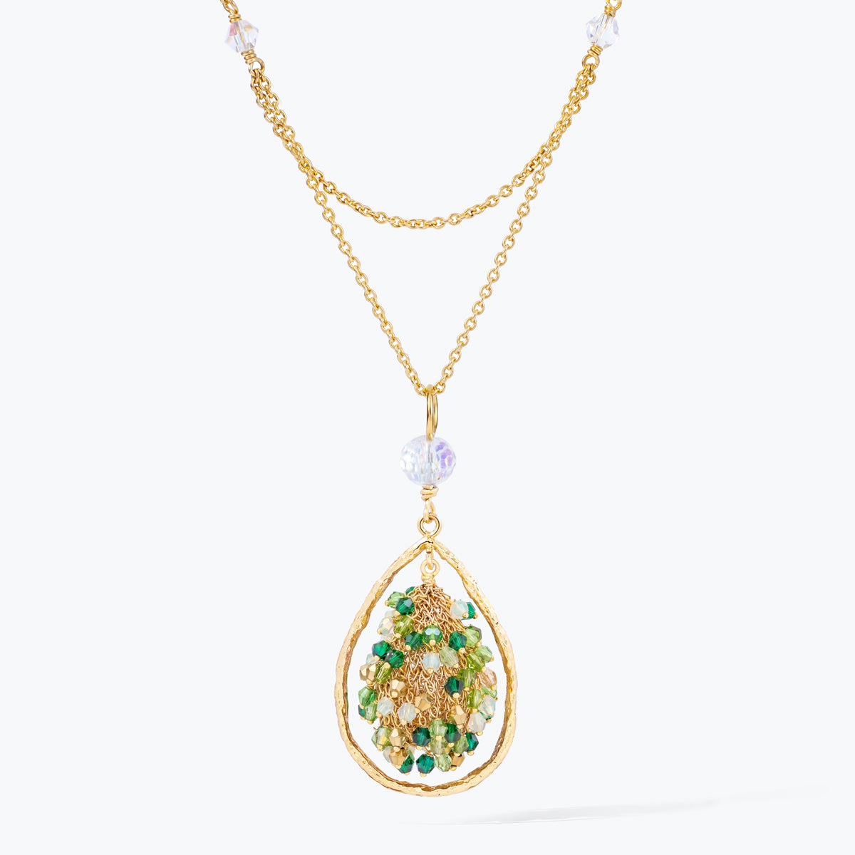 Gold handknitted tear drop wire mesh pendant necklace displaying a crescent cluster of green premium crystals.