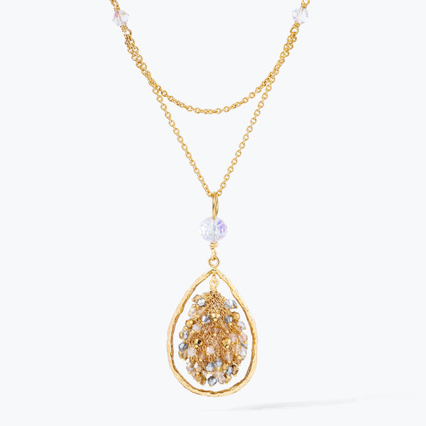 Gold handknitted tear drop wire mesh pendant bib necklace adorned with reflective crystals in champagne and silver tones.