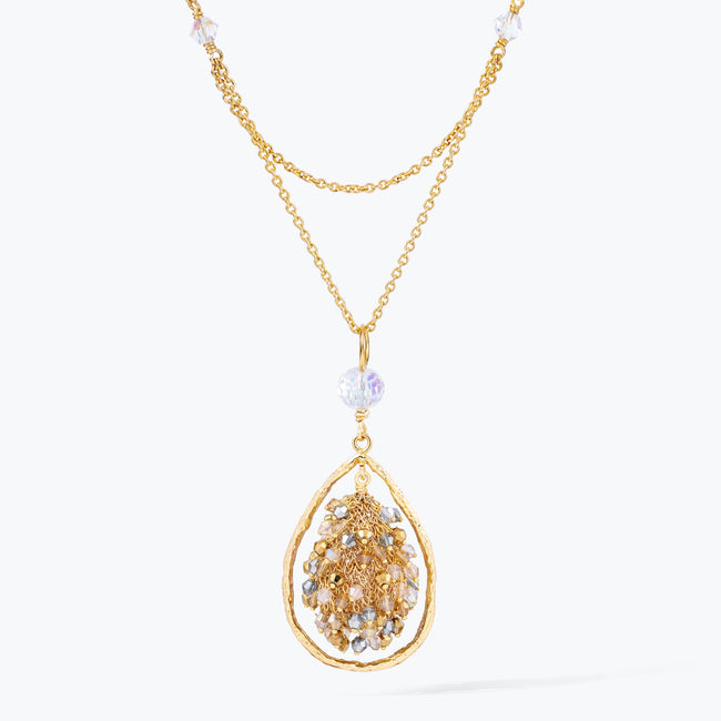 Gold handknitted tear drop wire mesh pendant bib necklace adorned with reflective crystals in champagne and silver tones.