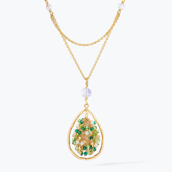 Gold handknitted tear drop wire mesh pendant necklace displaying a crescent cluster of green premium crystals.