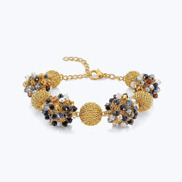 Gold bracelet featuring 9 ball handknitted wire mesh base with gunmetal, silver and bronze premium crystals.