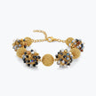 Gold bracelet featuring 9 ball handknitted wire mesh base with gunmetal, silver and bronze premium crystals.