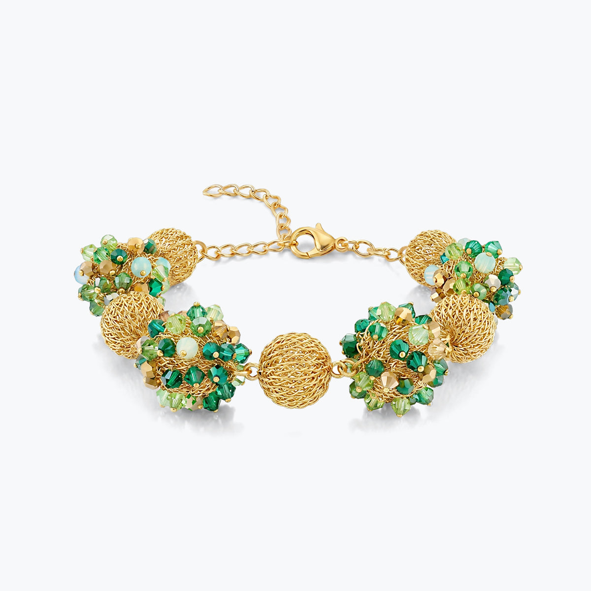 Gold bracelet featuring 9 ball handknitted wire holding emerald and mint green premium crystals.