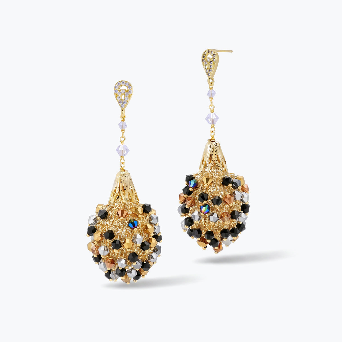 Gold drop earrings displaying a tear drop handknitted wire mesh structure with hanging bronze and black premium crystals.
