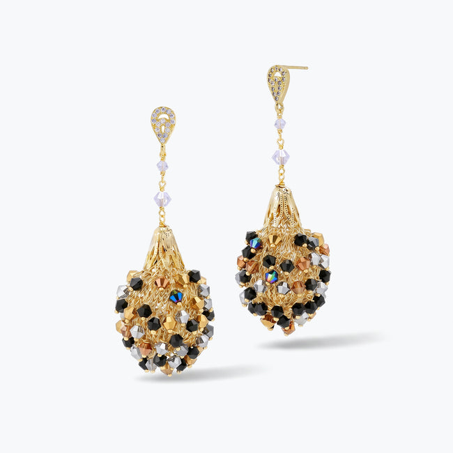 Gold drop earrings displaying a tear drop handknitted wire mesh structure with hanging bronze and black premium crystals.