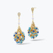 Gold drop earrings showing an egg handknitted wire design accented by cascading blue reflective crystals.